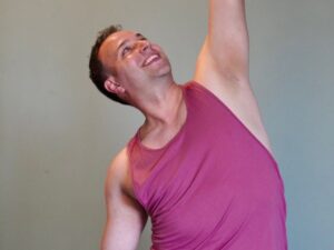 Man over 40 performing TRX row to improve strength and reduce joint pain.